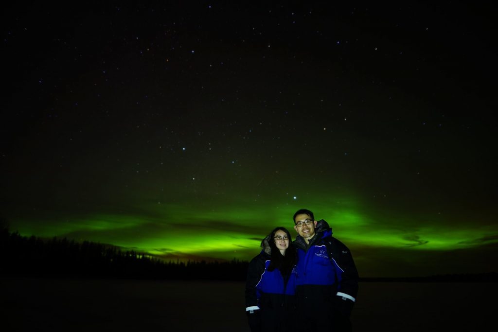 guests with aurora on the background