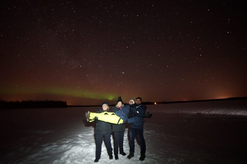 friends with northern lights on background