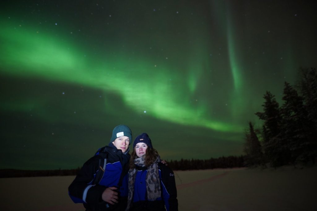 guests with aurora on the background