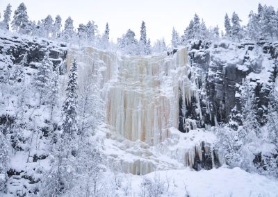 Majestic frozen waterfalls in Korouoma Canyon
