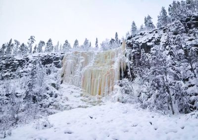 Majestic frozen waterfalls in Korouoma Canyon
