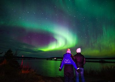 Enjoying the breathtaking show in the sky over Lapland