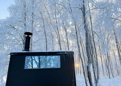 Sauna in the middle of frozen forest